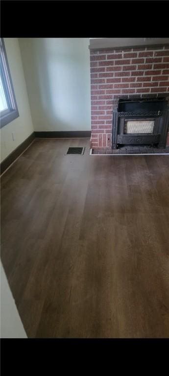 2722 Bethesda St, Carrick, PA 15227 - unfurnished living room featuring a fireplace and wood finished floors