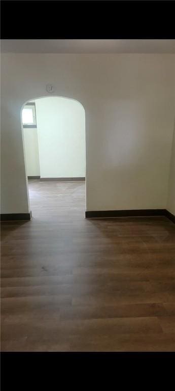 2722 Bethesda St, Carrick, PA 15227 - empty room with wood finished floors and arched walkways
