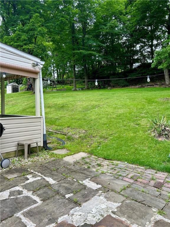 5936 Leprechaun Dr, Bethel Park, PA 15102 - view of green lawn with a patio and view of scattered trees