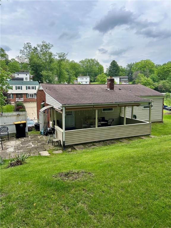 5936 Leprechaun Dr, Bethel Park, PA 15102 - rear view of house with a yard, a chimney, and a patio area