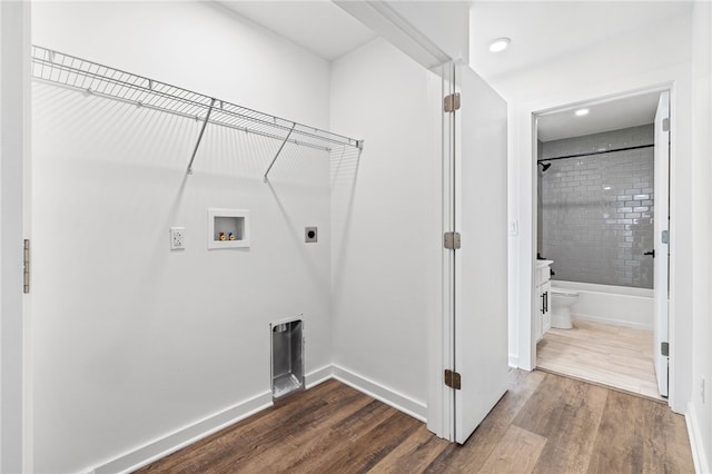 2127 Rose St, Hill District, PA 15219 - laundry room with electric dryer hookup, hookup for a washing machine, dark wood-type flooring, baseboards, and recessed lighting