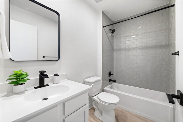2127 Rose St, Hill District, PA 15219 - bathroom with vanity, toilet, shower / tub combination, and wood finished floors