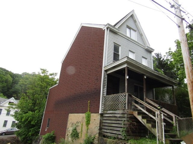 3024 Wadlow St, Brighton Heights, PA 15212 - view of front of home with a porch, stairway, and brick siding