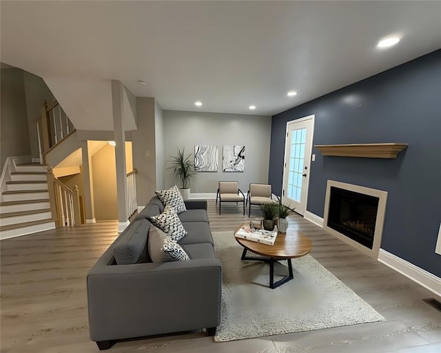 124 Hillvue Dr, Seven Fields Boro, PA 16046 - living area with wood finished floors, recessed lighting, a fireplace, and stairway