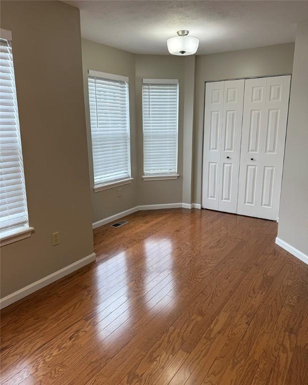 124 Hillvue Dr, Seven Fields Boro, PA 16046 - unfurnished bedroom with wood finished floors and a closet