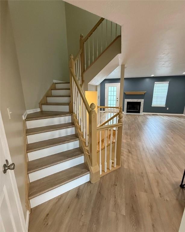 124 Hillvue Dr, Seven Fields Boro, PA 16046 - stairway featuring a fireplace and wood finished floors