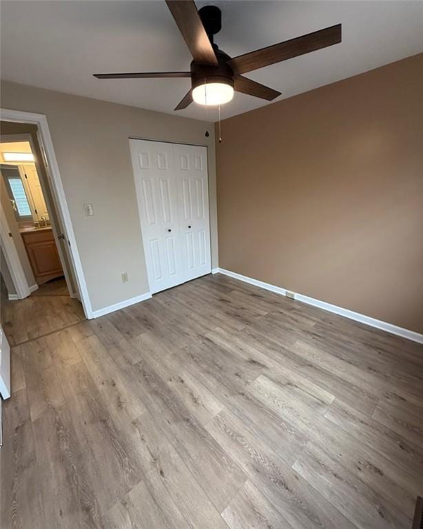 124 Hillvue Dr, Seven Fields Boro, PA 16046 - unfurnished bedroom with wood finished floors, a closet, and ceiling fan