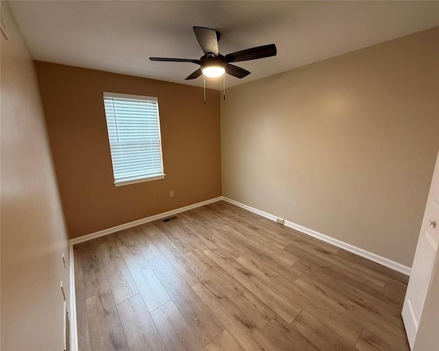 124 Hillvue Dr, Seven Fields Boro, PA 16046 - empty room with a ceiling fan and wood finished floors