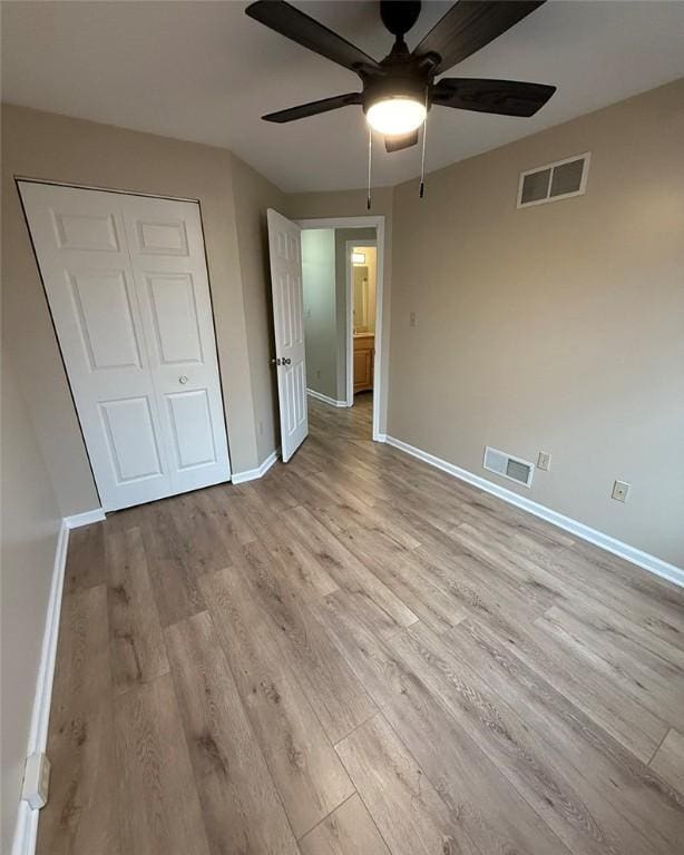 124 Hillvue Dr, Seven Fields Boro, PA 16046 - unfurnished bedroom featuring wood finished floors, a closet, and ceiling fan