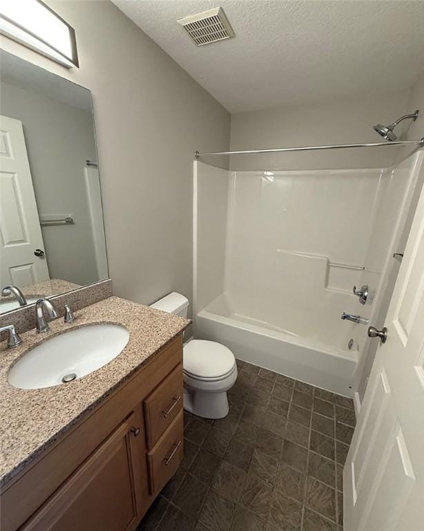 124 Hillvue Dr, Seven Fields Boro, PA 16046 - full bathroom featuring vanity, washtub / shower combination, and a textured ceiling