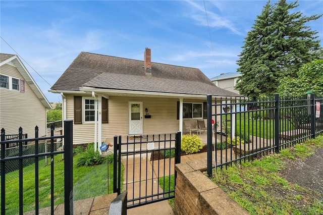 1204 Scorer St, Lincoln Place, PA 15207 - bungalow-style house featuring a chimney, a shingled roof, and a gate