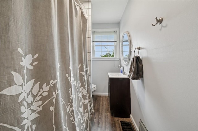 1204 Scorer St, Lincoln Place, PA 15207 - bathroom with toilet, vanity, wood-type flooring, tiled shower, and baseboards