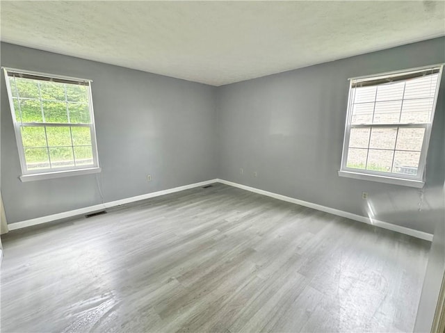 123 Pine Creek Dr, Peters Twp, PA 15367 - unfurnished room featuring baseboards, wood finished floors, and a textured ceiling