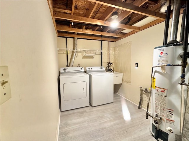 123 Pine Creek Dr, Peters Twp, PA 15367 - laundry area with water heater, washing machine and dryer, and light wood-style flooring