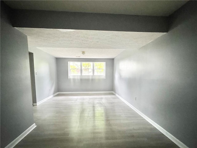 123 Pine Creek Dr, Peters Twp, PA 15367 - spare room featuring baseboards and wood finished floors