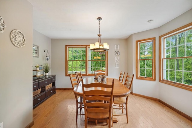 565 Leeper Rd, Green Twp, PA 15043 - dining space featuring light wood finished floors, a chandelier, and baseboards