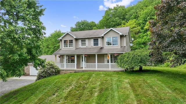 565 Leeper Rd, Green Twp, PA 15043 - view of front of home with covered porch, a front yard, driveway, and a garage