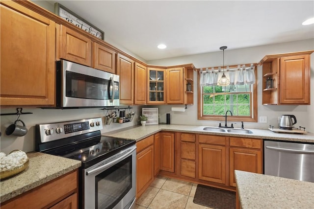 565 Leeper Rd, Green Twp, PA 15043 - kitchen with stainless steel appliances, a sink, brown cabinets, and recessed lighting