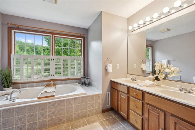 565 Leeper Rd, Green Twp, PA 15043 - full bathroom with double vanity, a garden tub, and tile patterned flooring
