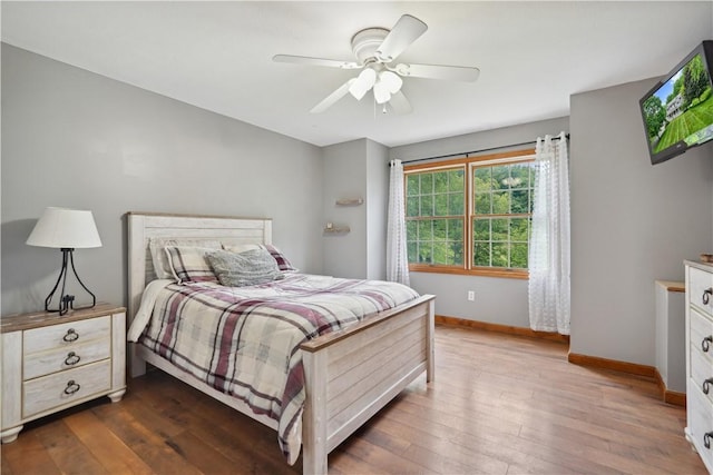565 Leeper Rd, Green Twp, PA 15043 - bedroom with baseboards, wood-type flooring, and a ceiling fan