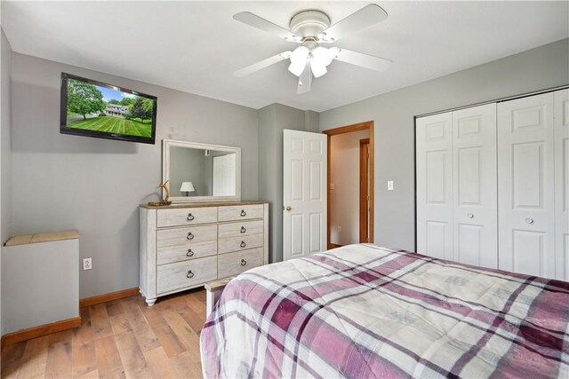 565 Leeper Rd, Green Twp, PA 15043 - bedroom with light wood-style floors, a closet, baseboards, and a ceiling fan