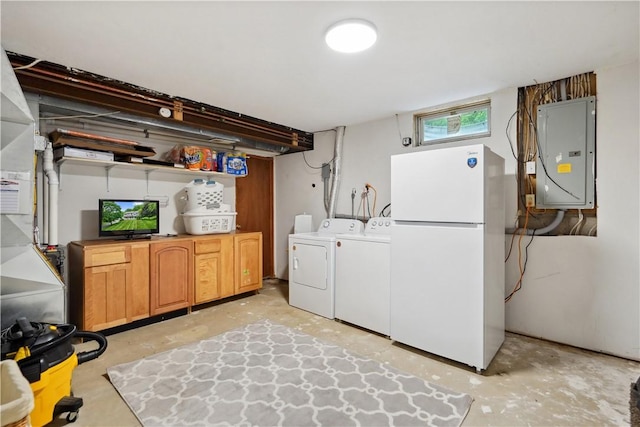 565 Leeper Rd, Green Twp, PA 15043 - below grade area featuring freestanding refrigerator, electric panel, and separate washer and dryer