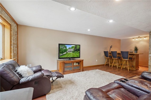 565 Leeper Rd, Green Twp, PA 15043 - living room with wood finished floors, bar, baseboards, recessed lighting, and a textured ceiling
