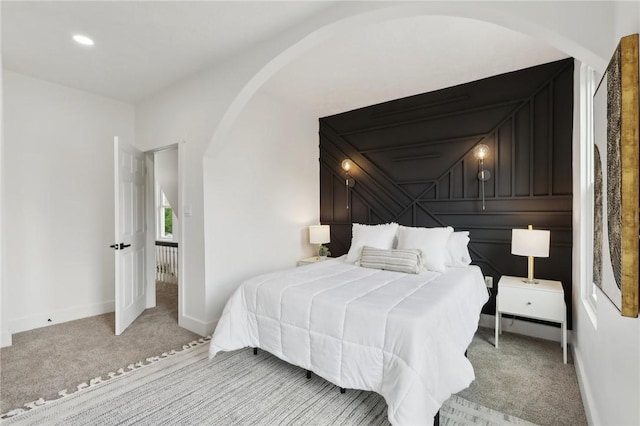 419 Jefferson Ave, Bellevue, PA 15202 - bedroom with light colored carpet, arched walkways, and baseboards