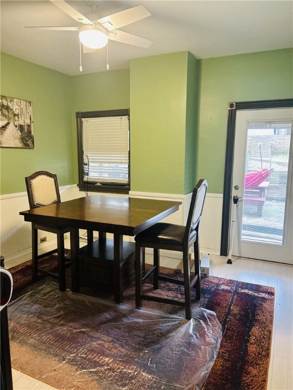 4236 Haldane St, Greenfield, PA 15207 - dining room with wainscoting, wood finished floors, and a ceiling fan