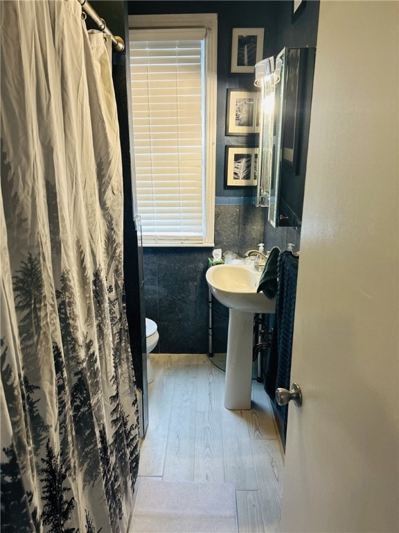 4236 Haldane St, Greenfield, PA 15207 - bathroom featuring wood finished floors, toilet, and a shower with shower curtain