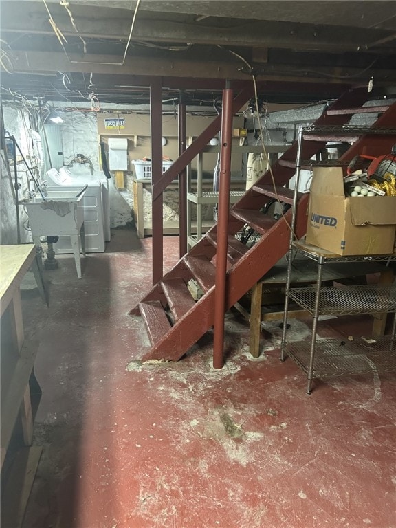 4236 Haldane St, Greenfield, PA 15207 - unfinished basement featuring washing machine and dryer, stairs, and a sink
