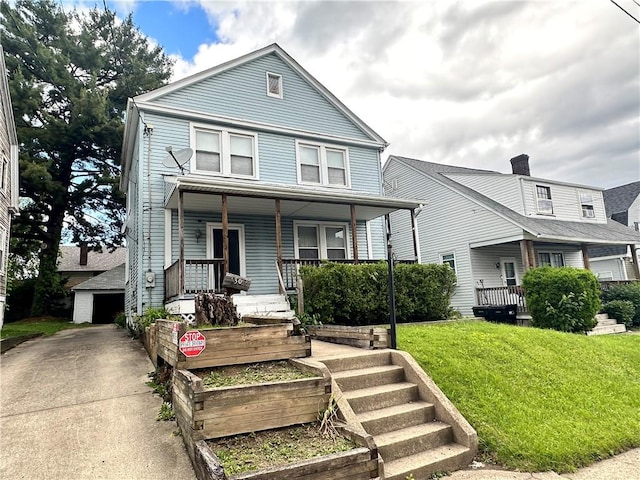 1308 Main St, Aliquippa, PA 15001 - view of front of house featuring a porch, a front lawn, a garage, and an outdoor structure