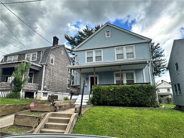 1308 Main St, Aliquippa, PA 15001 - american foursquare style home with a porch and a front lawn