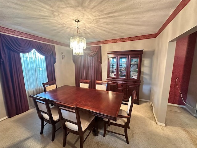 1308 Main St, Aliquippa, PA 15001 - dining space featuring a chandelier, light carpet, a textured ceiling, and baseboards