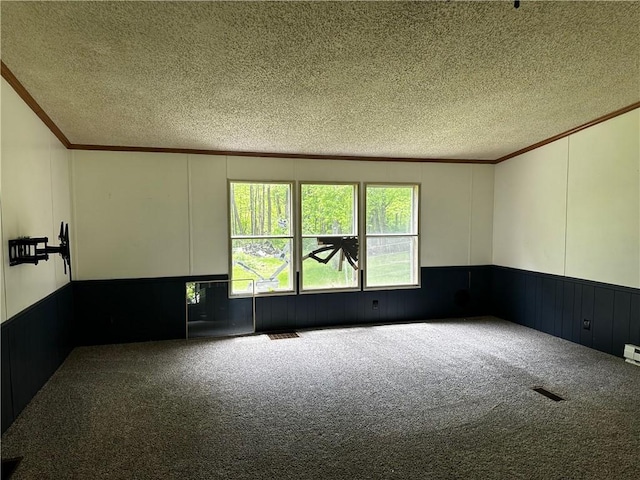 122 Arrowhead Rd, Allegheny Twp But, PA 16373 - carpeted empty room with crown molding, a textured ceiling, a decorative wall, and a wainscoted wall