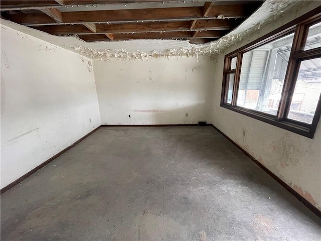 1209 Scott St, Mckeesport, PA 15132 - empty room with concrete floors and baseboards