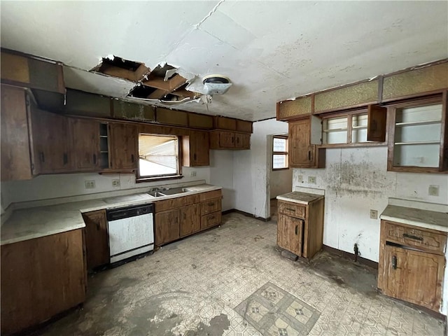 1209 Scott St, Mckeesport, PA 15132 - kitchen with open shelves, dishwashing machine, a sink, baseboards, and light countertops