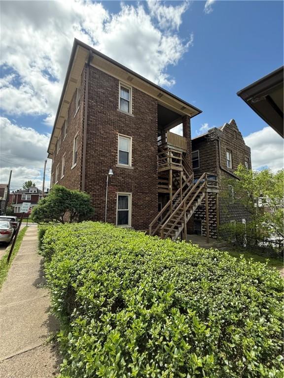 17 Lenox Ave, Forest Hills Boro, PA 15221 - rear view of house featuring stairs and brick siding