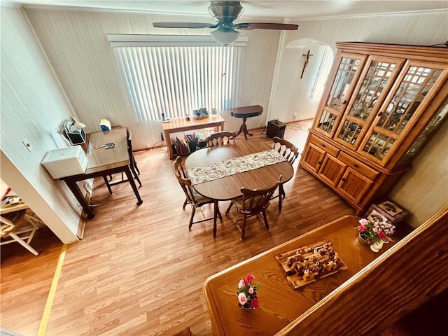 1129 1st St, Redstone Twp, PA 15442 - dining area featuring arched walkways, wood finished floors, and a ceiling fan