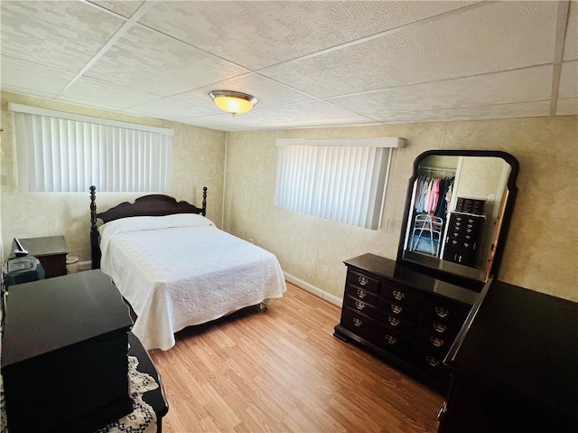1129 1st St, Redstone Twp, PA 15442 - bedroom with wood finished floors, a paneled ceiling, and baseboards