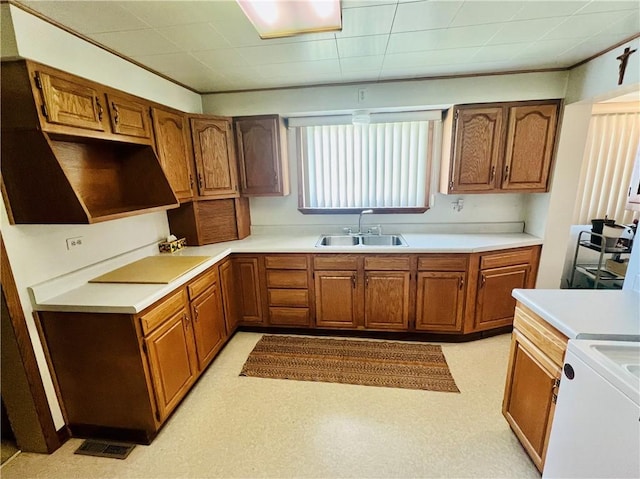 1129 1st St, Redstone Twp, PA 15442 - kitchen with a sink, brown cabinetry, black electric cooktop, and light countertops