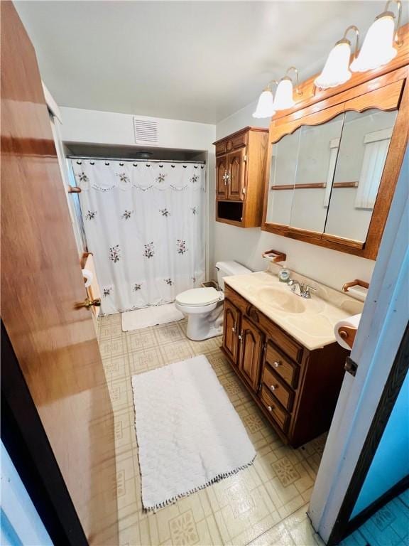 1129 1st St, Redstone Twp, PA 15442 - full bath featuring tile patterned floors, vanity, toilet, and a shower with shower curtain