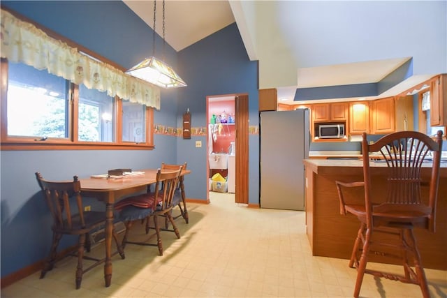 105 Janice Ln, Saxonburg, PA 16056 - dining area featuring high vaulted ceiling and baseboards