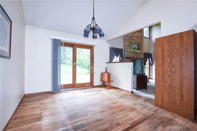 105 Janice Ln, Saxonburg, PA 16056 - unfurnished dining area with wood-type flooring, a chandelier, and high vaulted ceiling