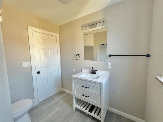 183 Pittsburgh Cir, Ellwood City Law, PA 16117 - bathroom featuring vanity, wood finished floors, toilet, and baseboards