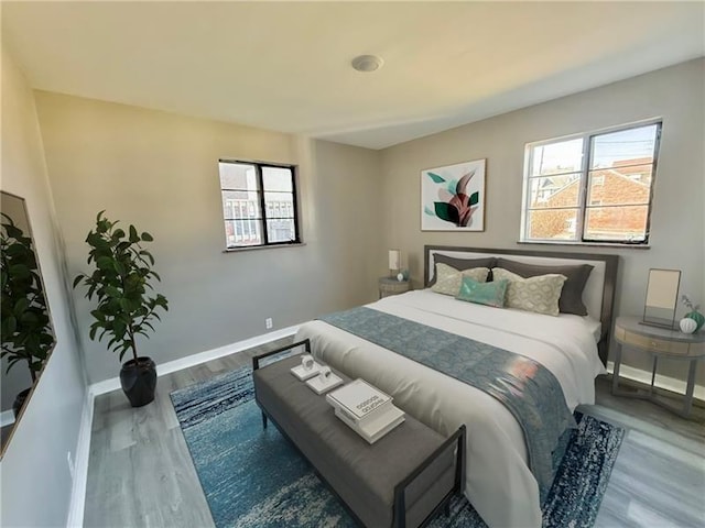 183 Pittsburgh Cir, Ellwood City Law, PA 16117 - bedroom with multiple windows, wood finished floors, and baseboards