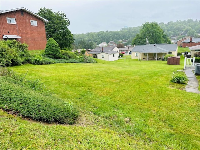 1026 Jefferson Ave, Jeannette, PA 15644 - view of green lawn with cooling unit and a residential view