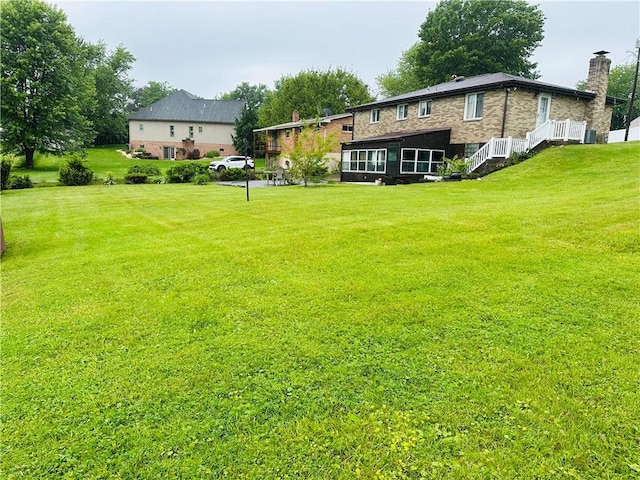 1026 Jefferson Ave, Jeannette, PA 15644 - view of green lawn with a sunroom