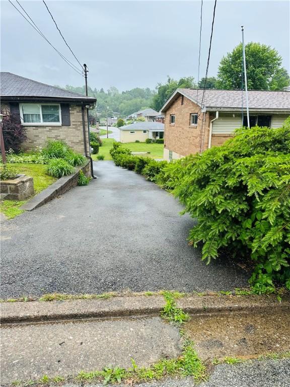 1026 Jefferson Ave, Jeannette, PA 15644 - view of home's exterior with brick siding