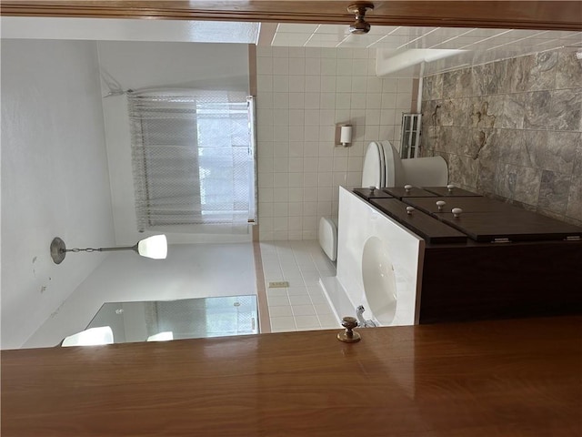 1026 Jefferson Ave, Jeannette, PA 15644 - bathroom featuring toilet, tile patterned floors, and tile walls